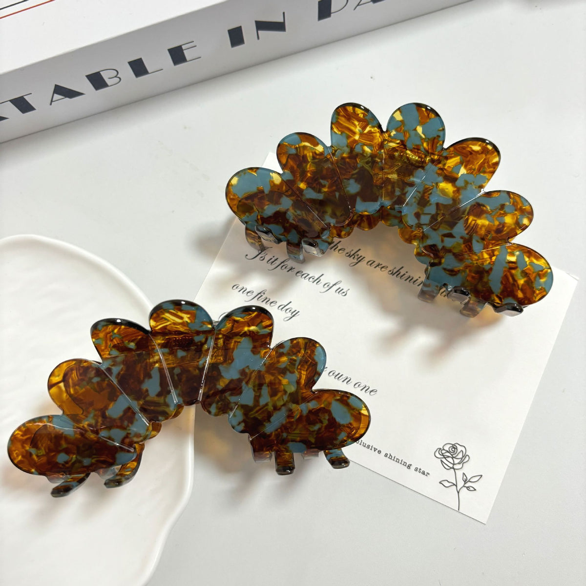 Petal Large Grip Hair Accessories featuring elegant tortoise and teal design clips for stylish hair updos.