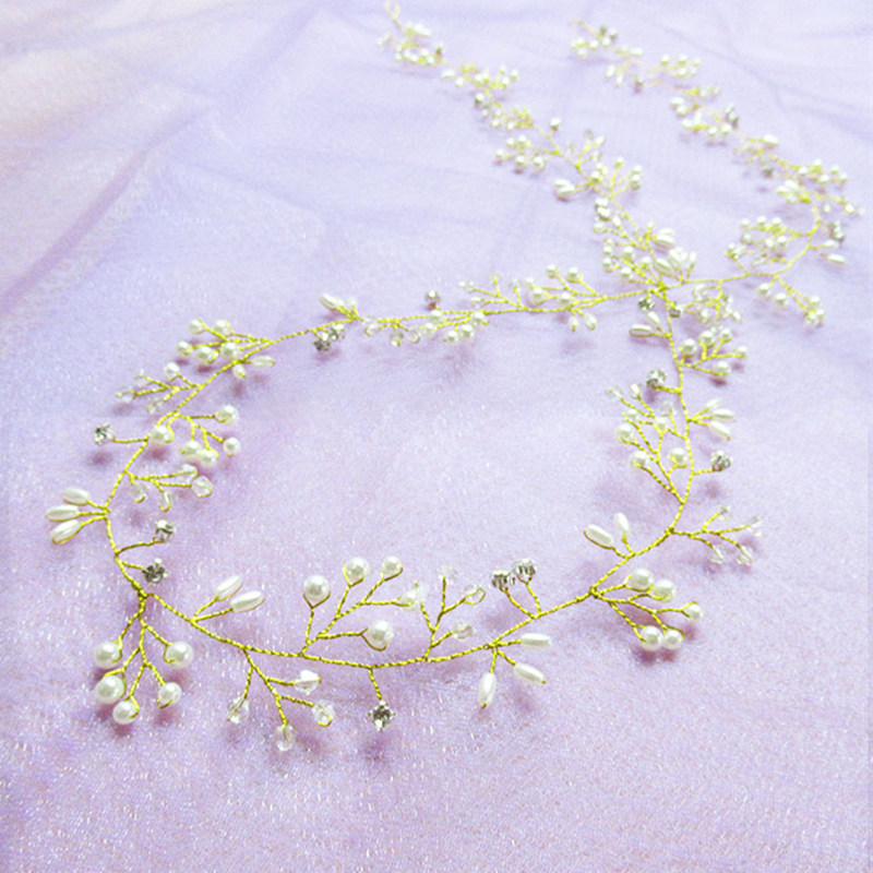 Elegant Wedding Hair Accessories featuring crystal and pearl details on a delicate gold band.