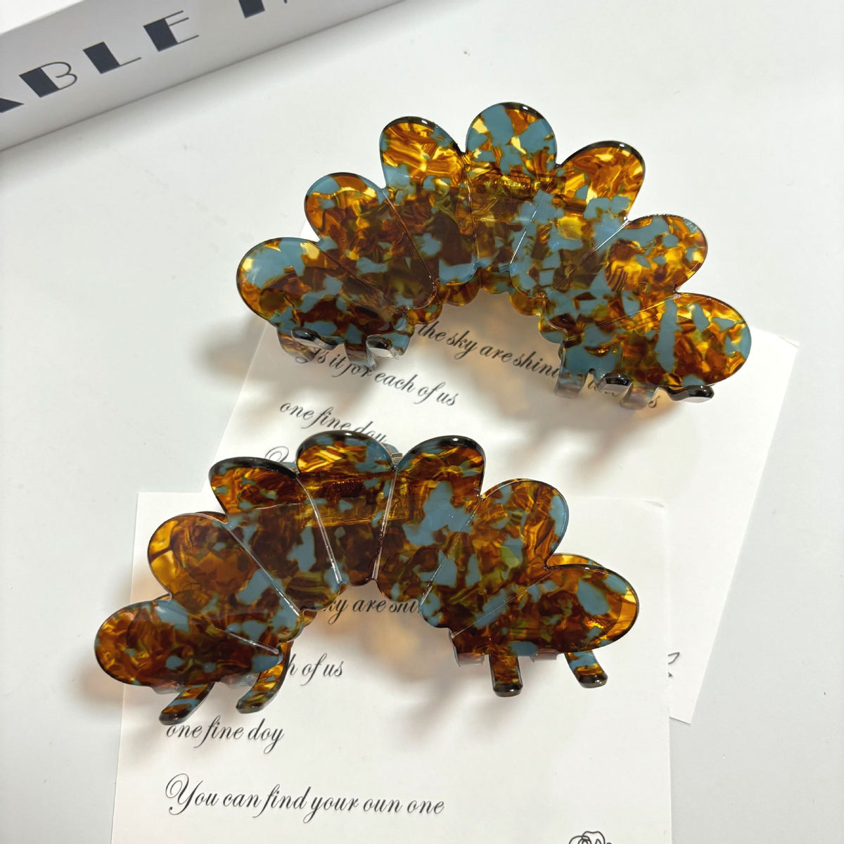 Petal large grip hair accessories in tortoiseshell design, perfect for elegant updos, displaying beautiful petal shapes.